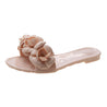 Pink sandal with floral design on a white background
