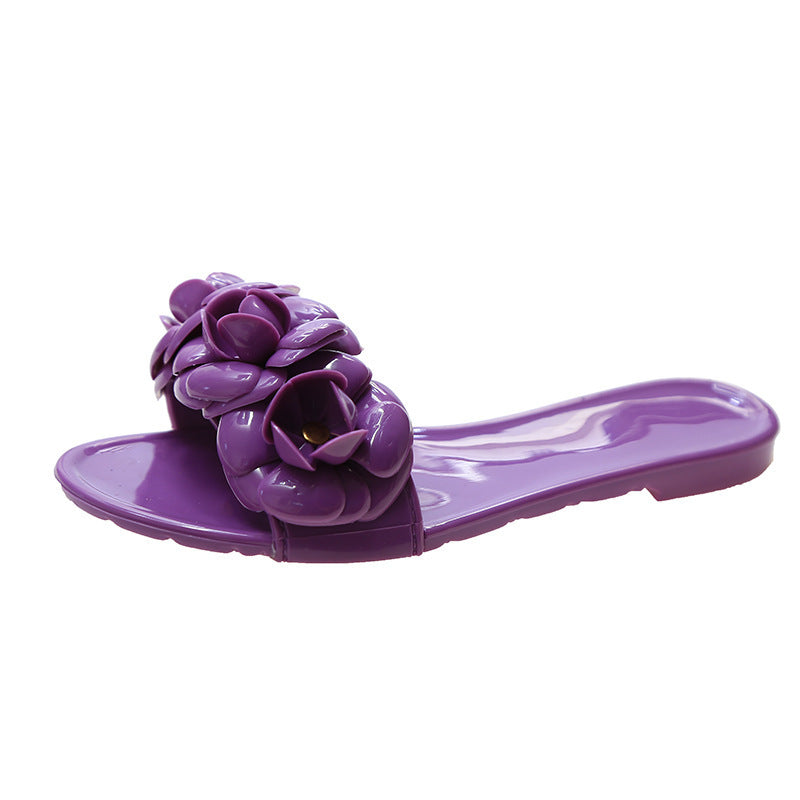 Purple sandal with floral design on a white background
