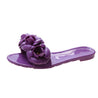 Purple sandal with floral design on a white background