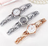 Three elegant wristwatches in silver, rose gold, and rose gold with white face on a light background.